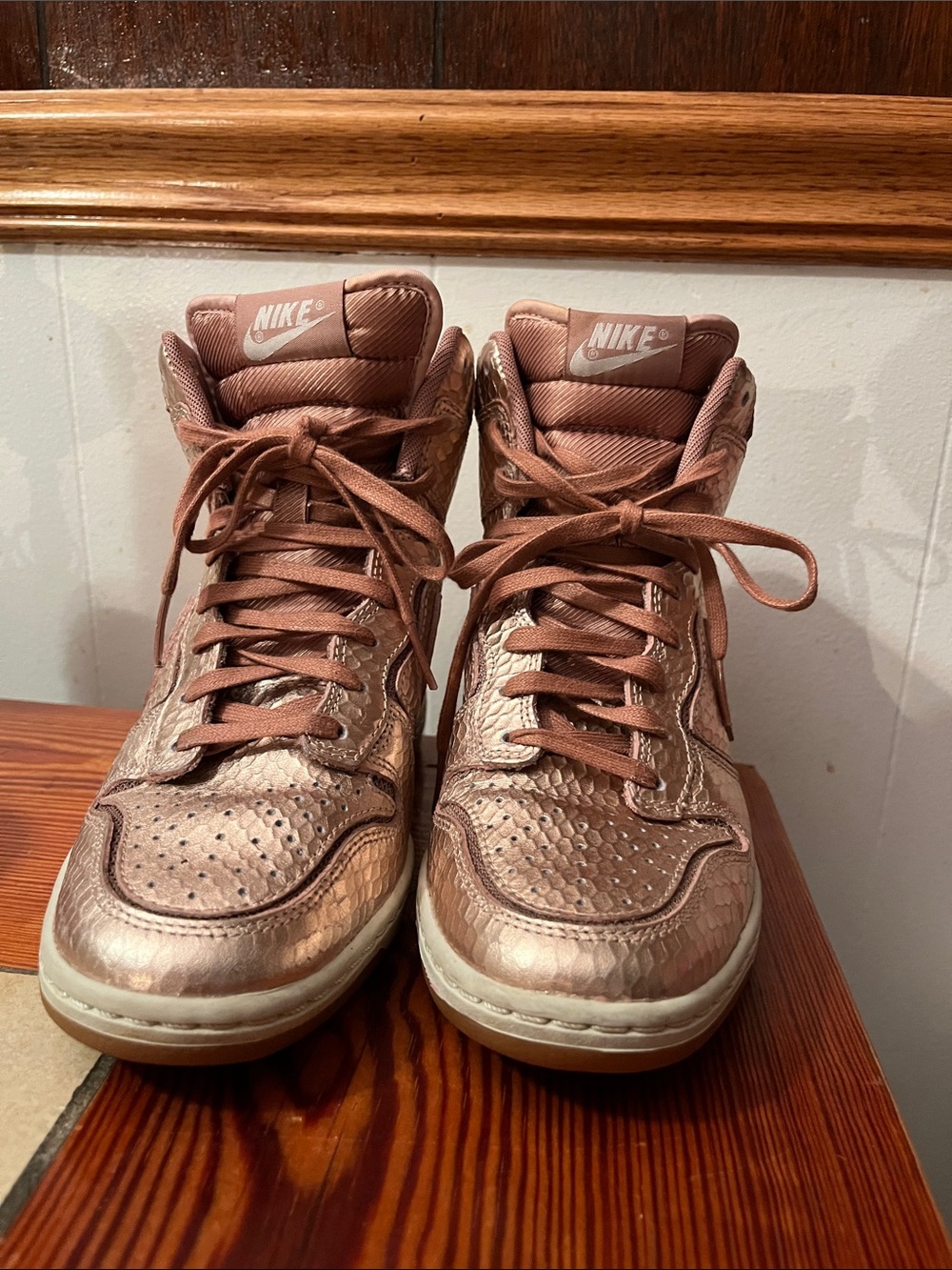 Nike Women’s High-Top Sneakers in Metallic Rose